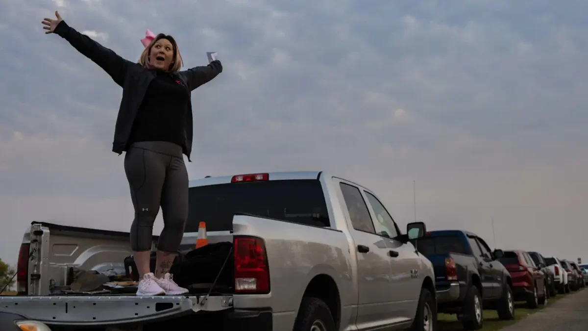 Tech. Sgt. Brandee Hahn, 5th Security Forces Squadron Combat Arms and 5 SFS Armory section chief, delivers a speech before a breast cancer 5k at Minot Air Force Base, North Dakota, Oct. 10, 2024.  (U.S. Air Force photo by Airman 1st Class Alyssa Bankston)