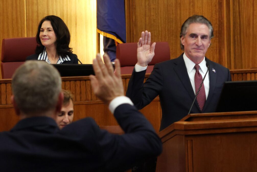 Gov. Doug Burgum swears in new state senators in the Senate chamber during the organizational session at the Capitol on Dec. 2, 2024. (Michael Achterling/North Dakota Monitor)